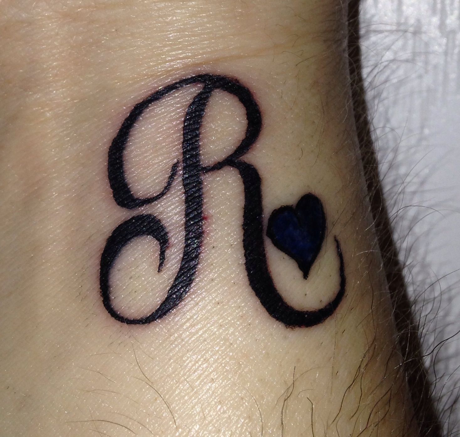 R initial tattoo