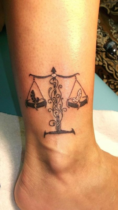 Татто Libra