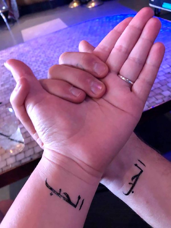 Arabic Tattoo on Ribs girl