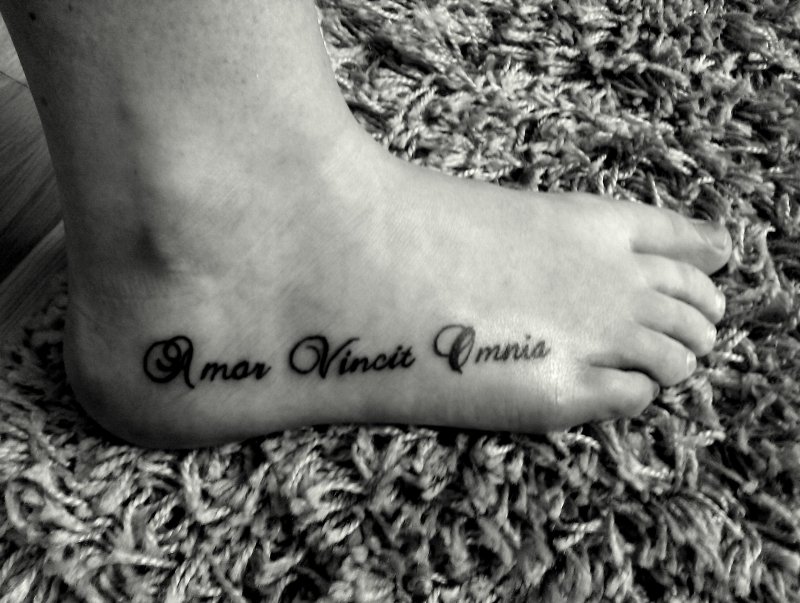 Amor vincit Omnia тату