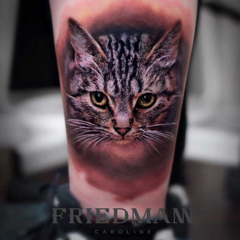 Тату черный котенок